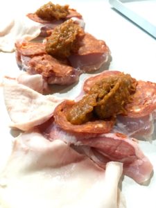 Assembling Italian chicken thighs